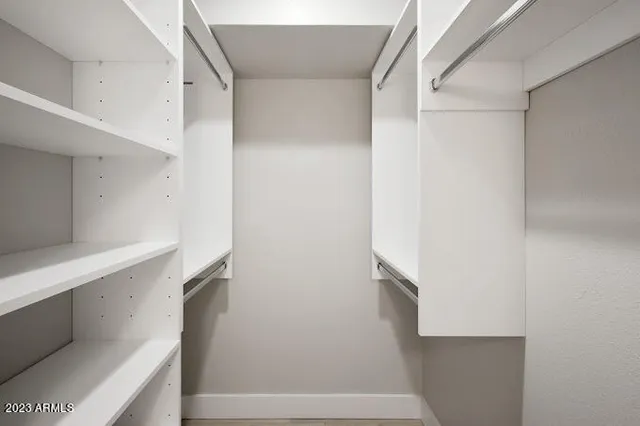 a bathroom with a sink double vanity and a mirror