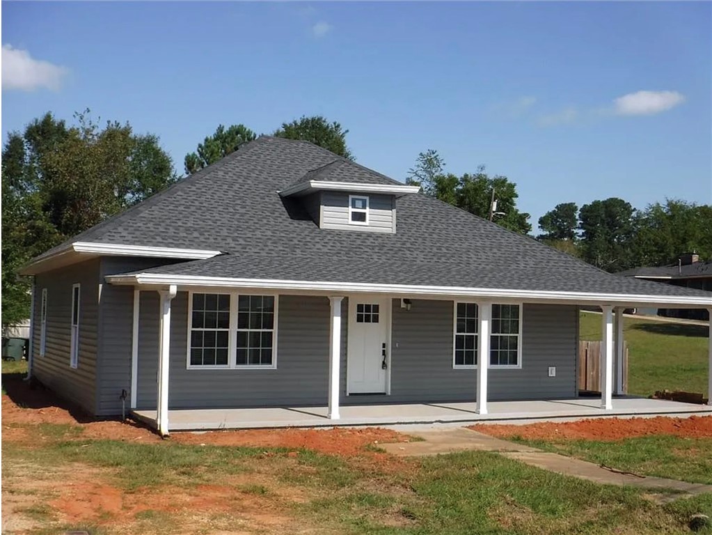 308 South Poplar Street Seneca, SC 29678 - Photo 1 of 9 This charming home offers a welcoming facade with a classic porch, perfect for enjoying outdoor moments.