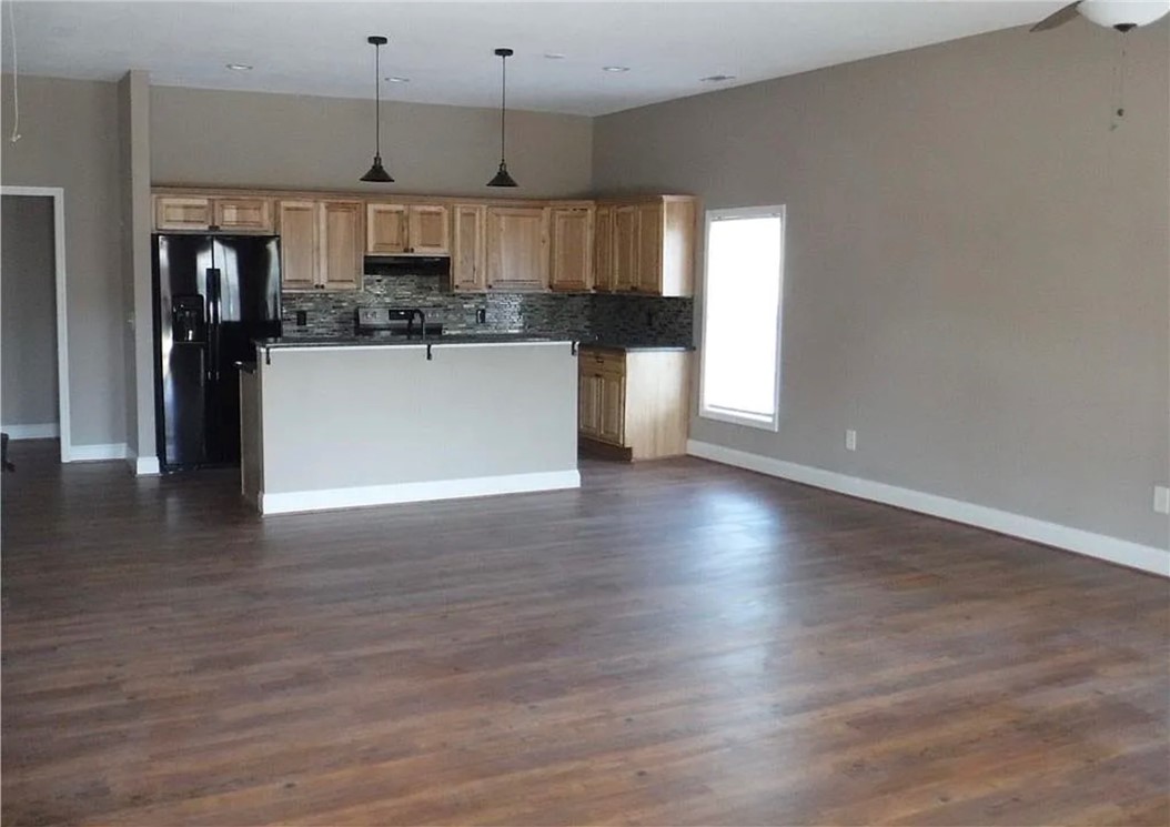 308 South Poplar Street Seneca, SC 29678 - Photo 7 of 9 Modern kitchen with wood flooring and ample space for dining or relaxation.