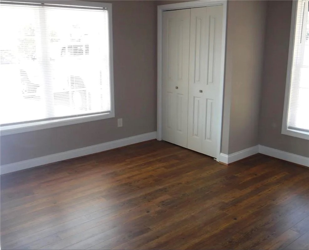 308 South Poplar Street Seneca, SC 29678 - Photo 9 of 9 This bright room features beautiful flooring, offering a versatile space for comfortable living.