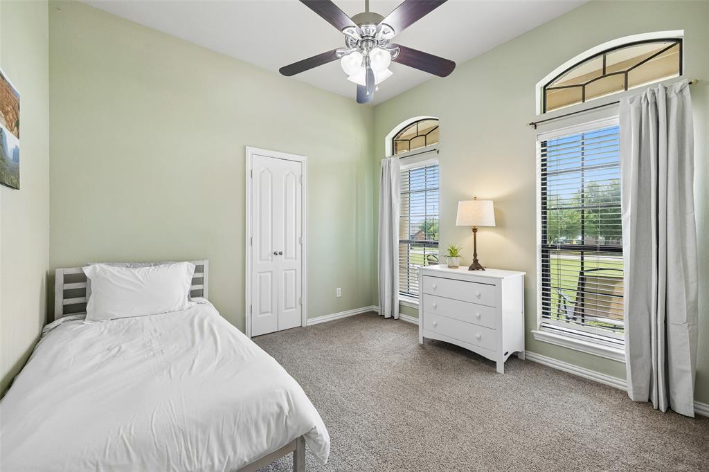 11211 Emerald Ranch Lane Forney, TX 75126 - Photo 27 of 35 Secondary Bedroom #1 featuring vaulted ceilings and neutral wall paint