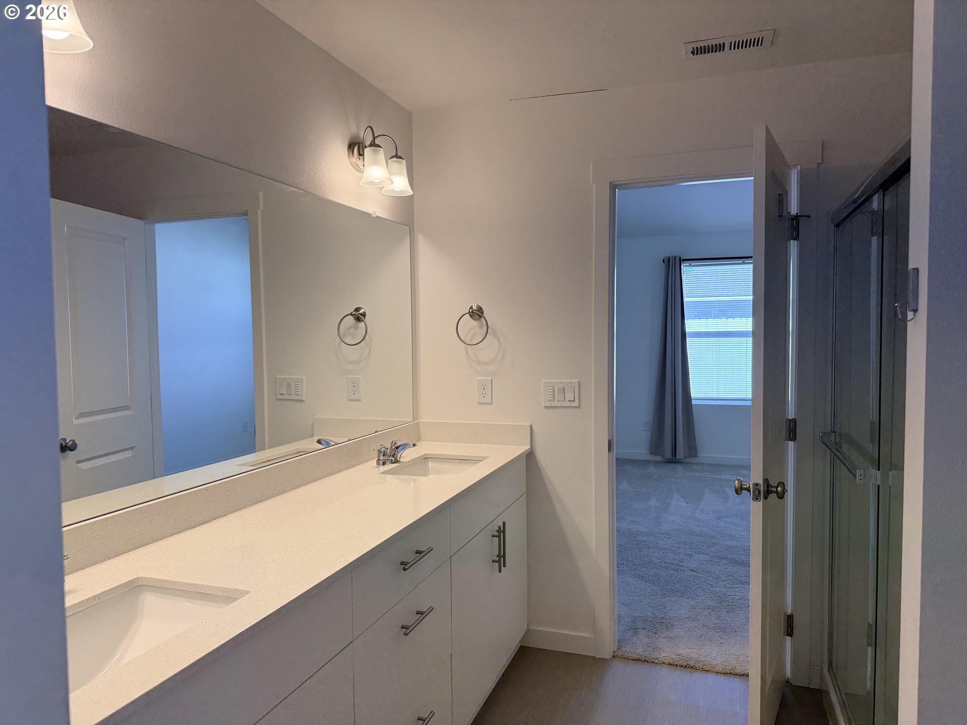 213 River Ridge Drive Boardman, OR 97818 - Photo 6 of 12 a bathroom with a double vanity sink and a mirror