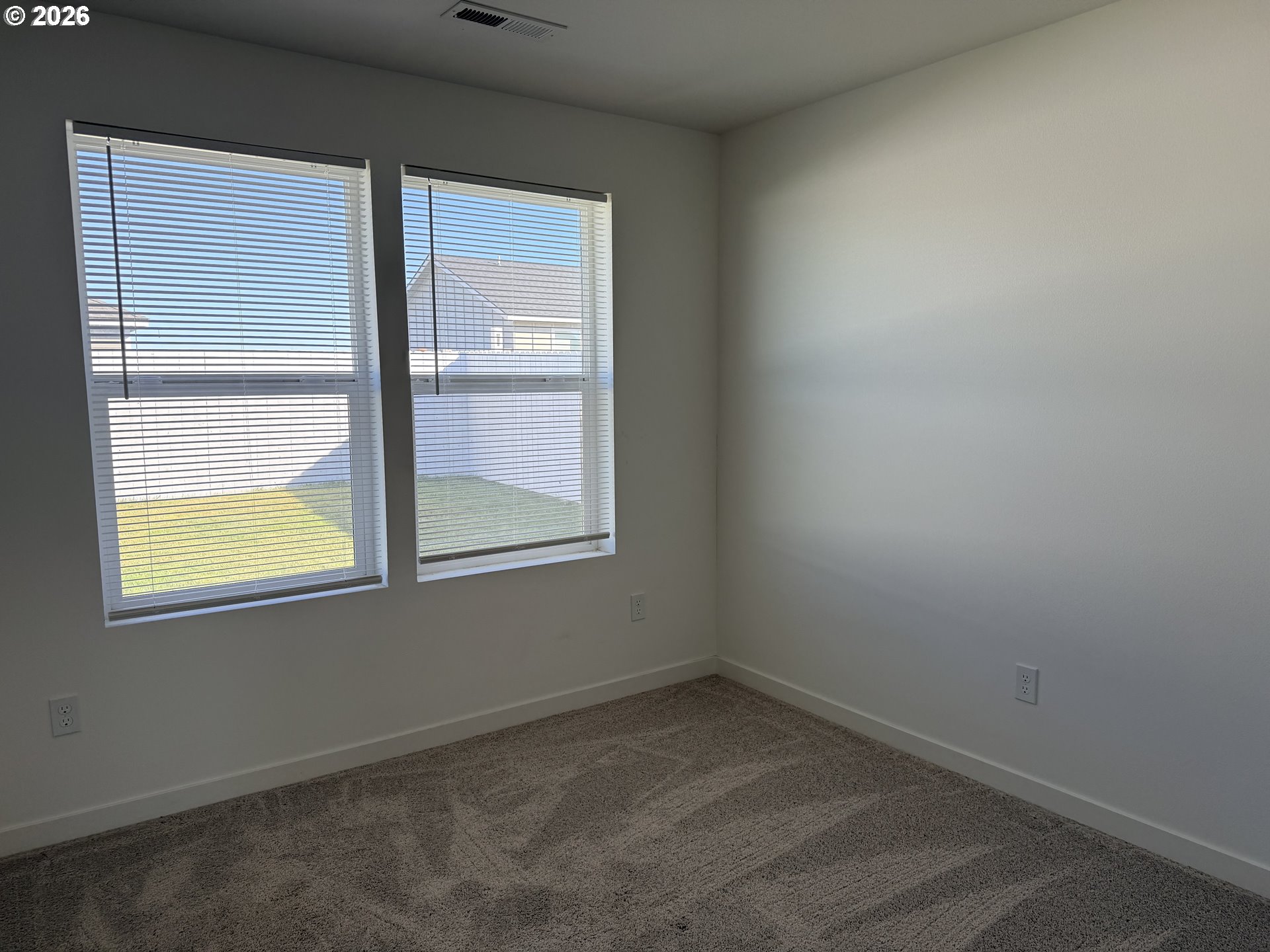 213 River Ridge Drive Boardman, OR 97818 - Photo 10 of 12 an empty room with a window
