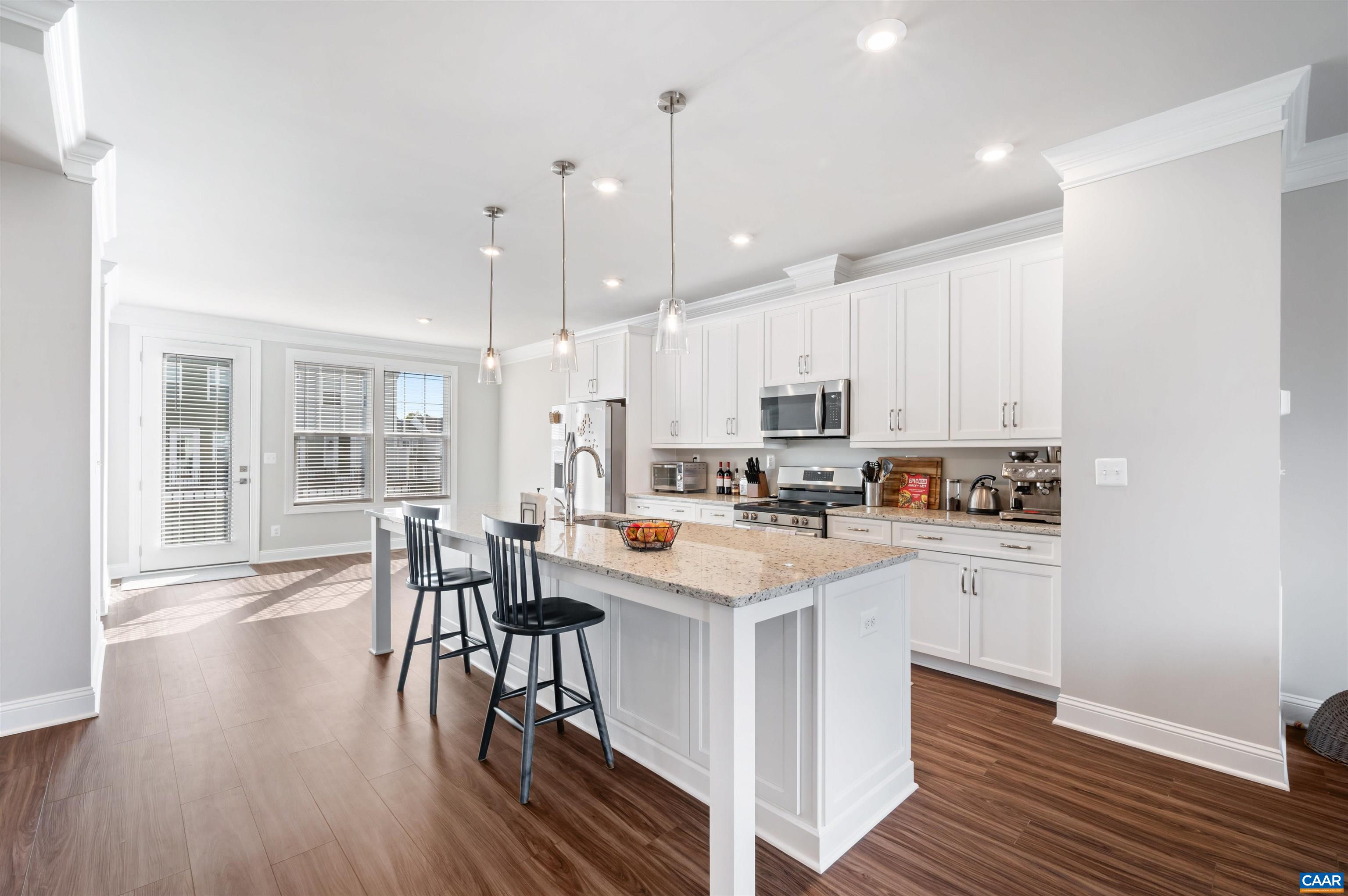 785 Park Ridge Drive Crozet, VA 22932 - Photo 13 of 50 a kitchen with stainless steel appliances a white stove top oven a sink dishwasher and a refrigerator with wooden floor