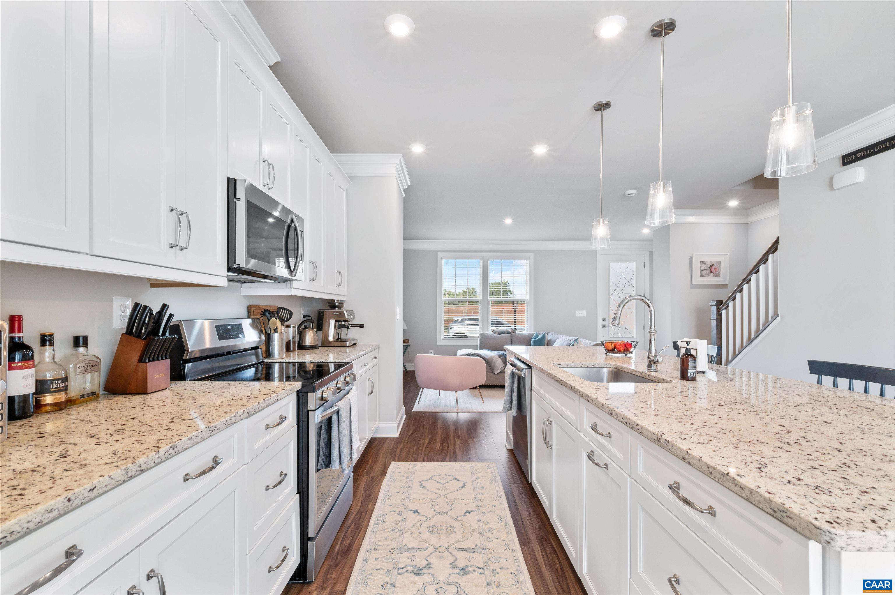 785 Park Ridge Drive Crozet, VA 22932 - Photo 19 of 50 a large white kitchen with lots of counter space sink and a stove