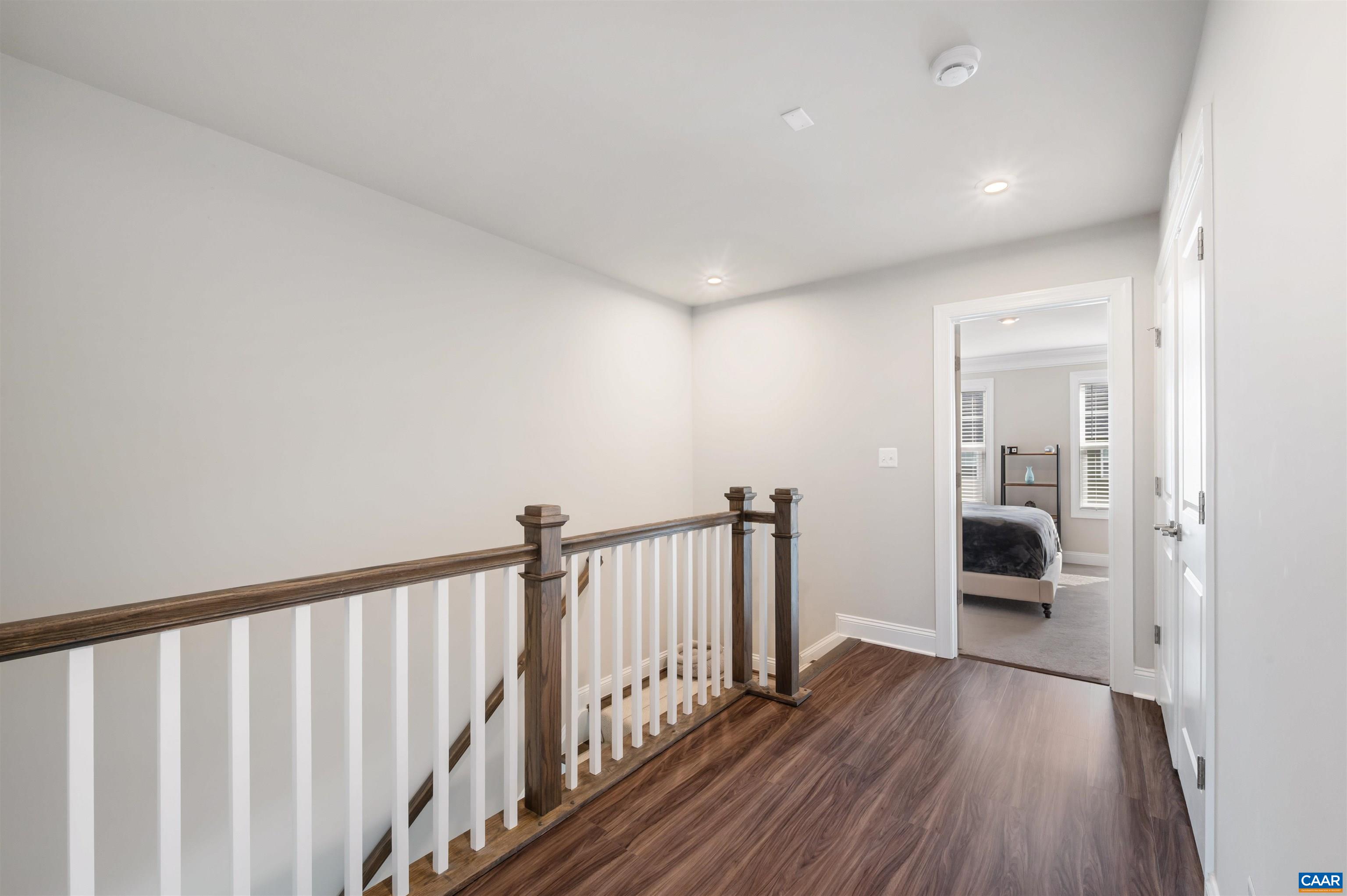 785 Park Ridge Drive Crozet, VA 22932 - Photo 24 of 50 a view of a hallway with wooden floor and staircase