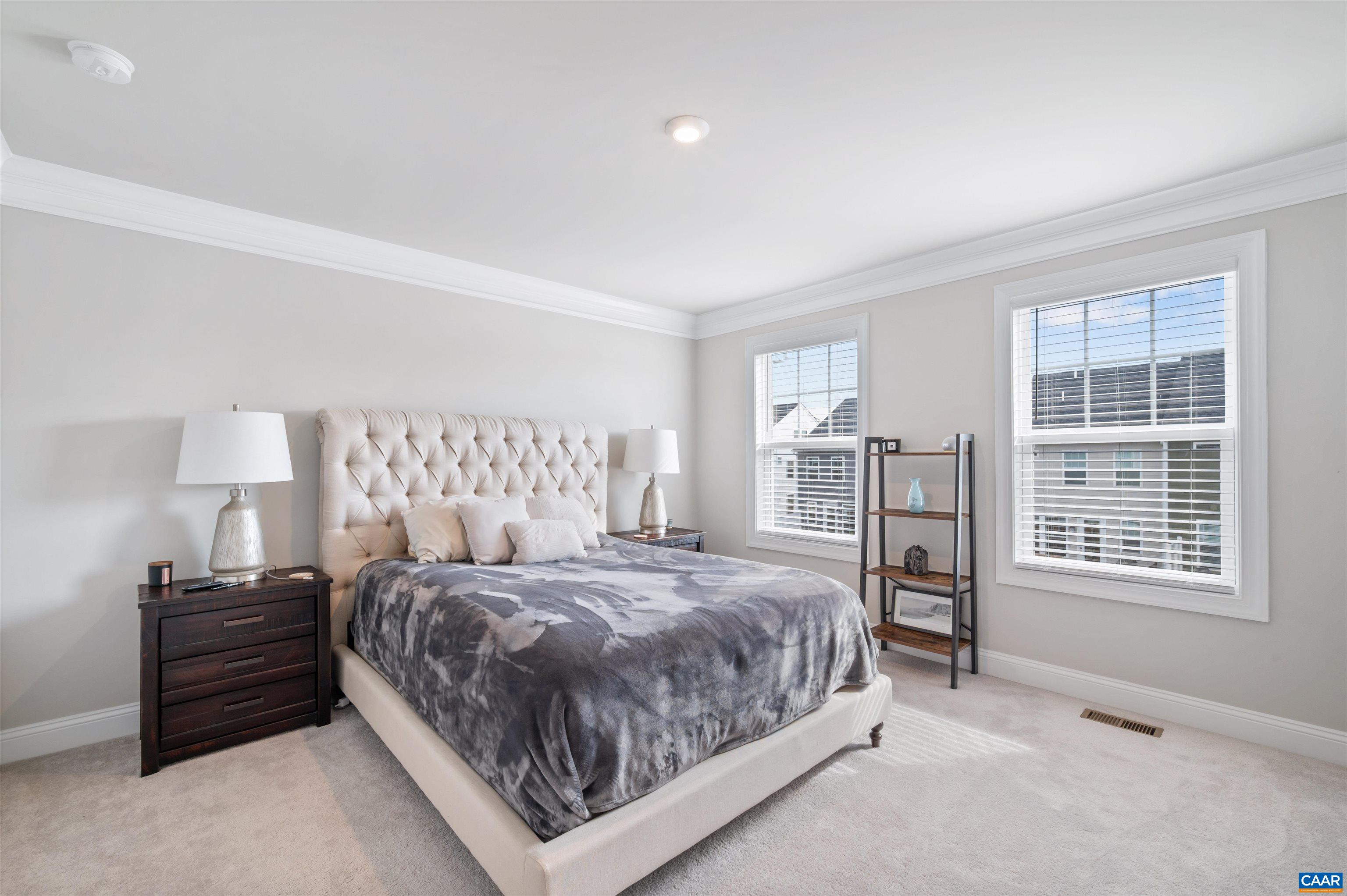 785 Park Ridge Drive Crozet, VA 22932 - Photo 25 of 50 a bedroom with a bed next to a window and a dresser