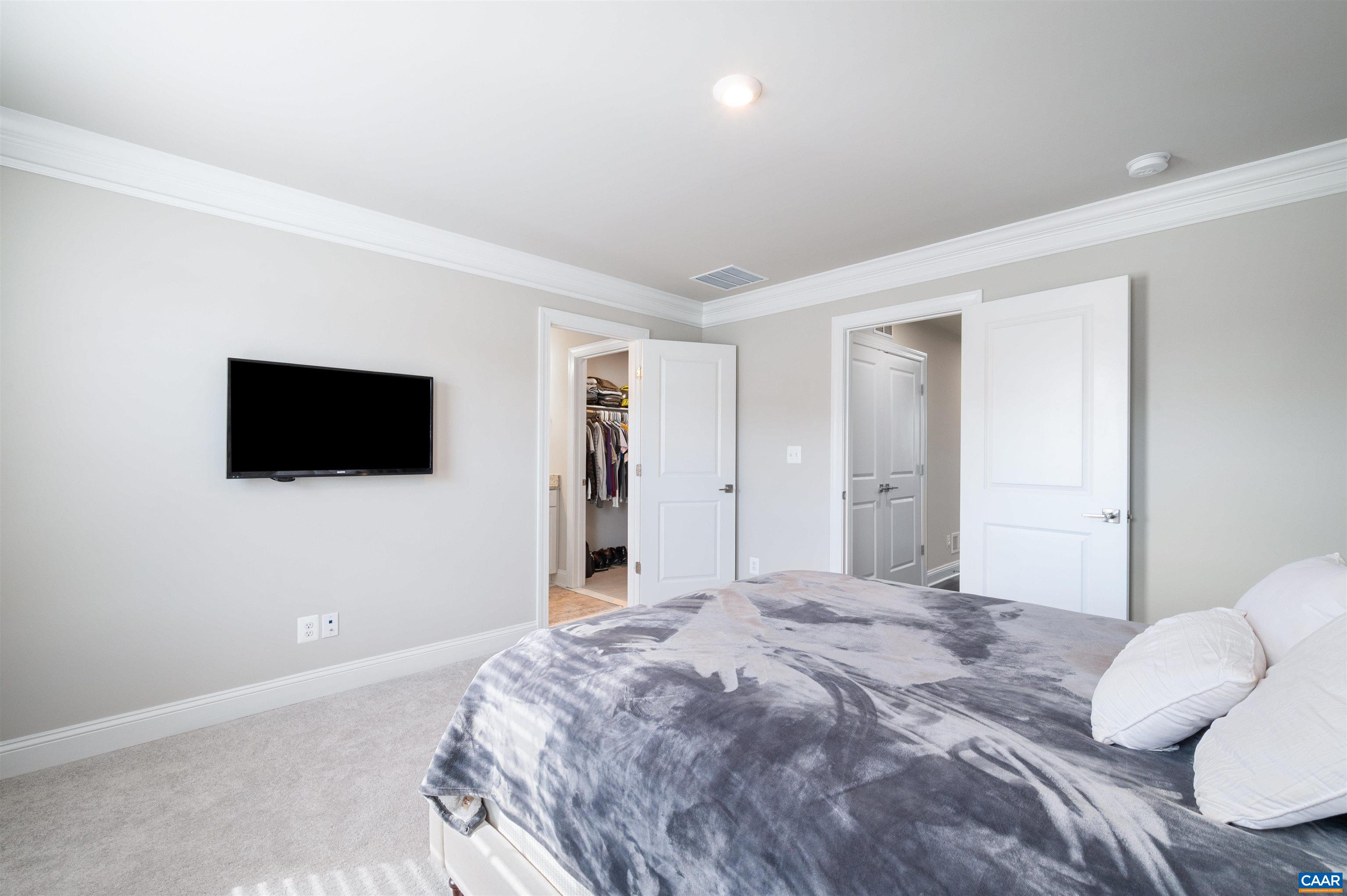 785 Park Ridge Drive Crozet, VA 22932 - Photo 26 of 50 a bedroom with a bed and a flat screen tv