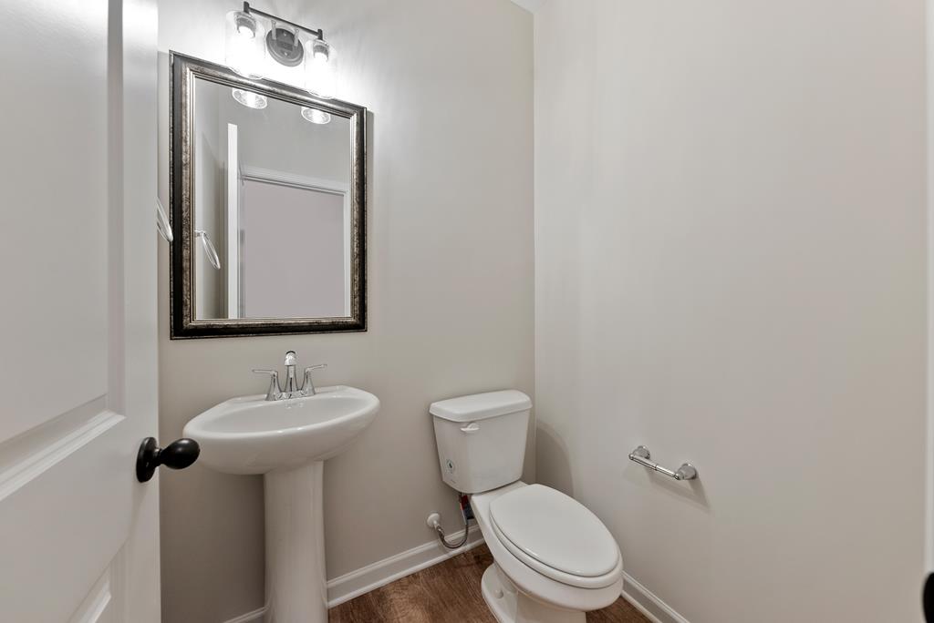 575 Bohannon Road Grantville, GA 30220 - Photo 14 of 33 a bathroom with a toilet sink and mirror