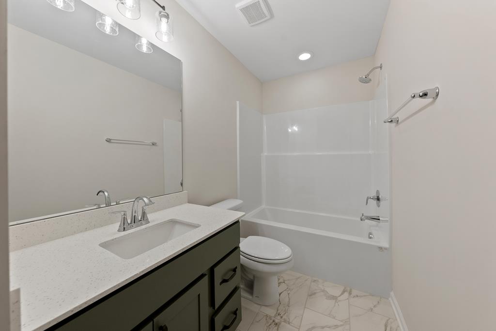 575 Bohannon Road Grantville, GA 30220 - Photo 16 of 33 a bathroom with a sink a toilet and shower