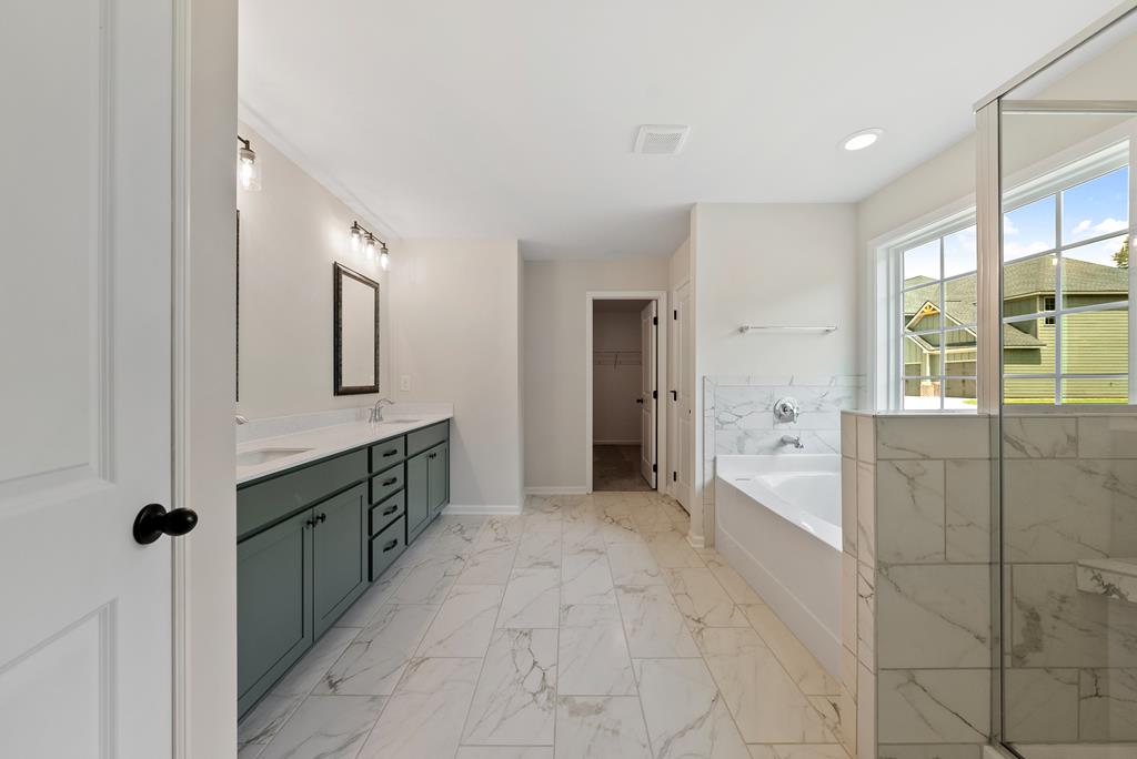 575 Bohannon Road Grantville, GA 30220 - Photo 26 of 33 a large bathroom with a tub and shower