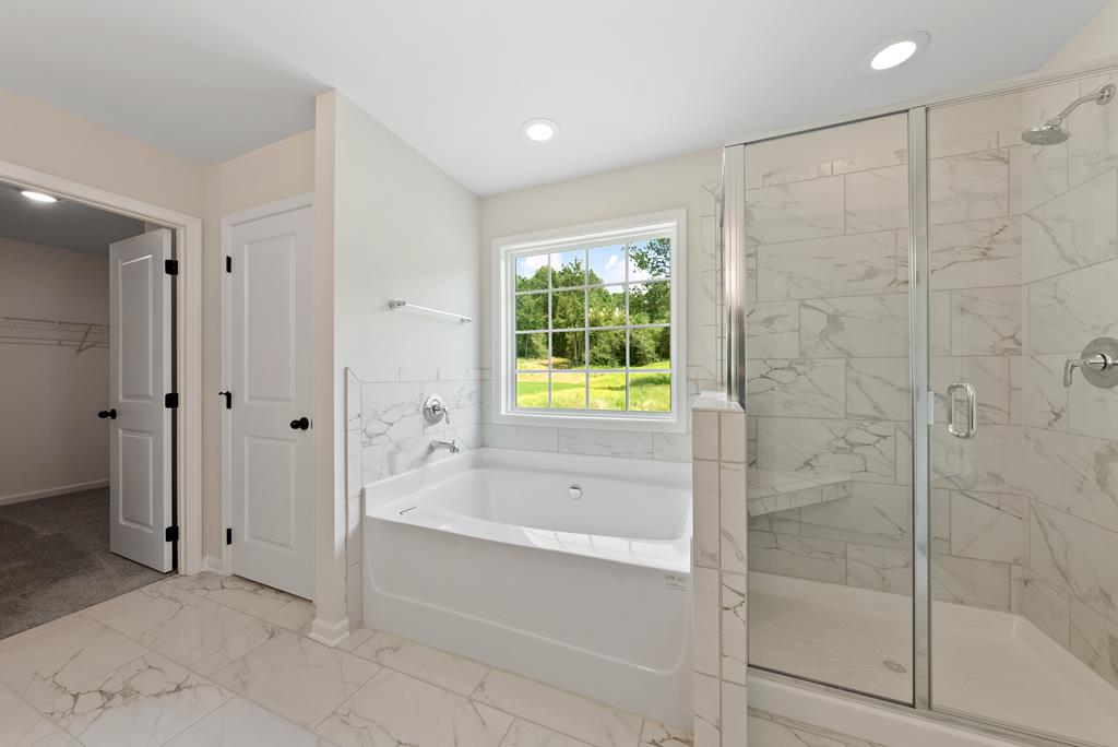 575 Bohannon Road Grantville, GA 30220 - Photo 27 of 33 a spacious bathroom with a bathtub and shower