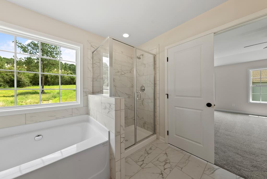 575 Bohannon Road Grantville, GA 30220 - Photo 28 of 33 a bathroom with a shower and a bathtub