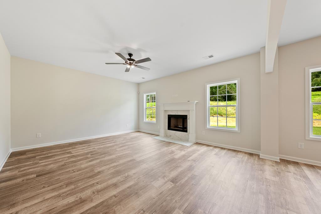 575 Bohannon Road Grantville, GA 30220 - Photo 6 of 33 an empty room with windows and fireplace
