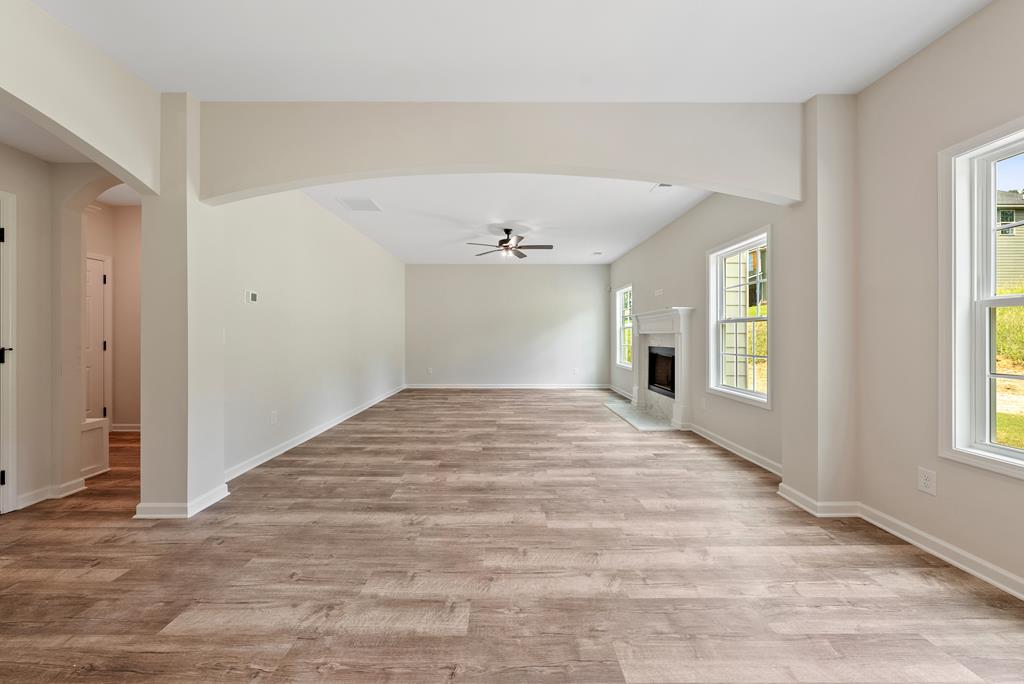 575 Bohannon Road Grantville, GA 30220 - Photo 7 of 33 a view of empty room with wooden floor and fan
