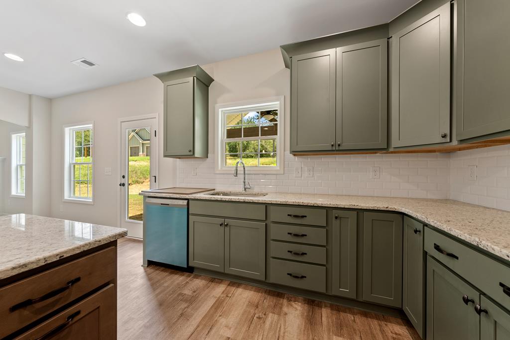 575 Bohannon Road Grantville, GA 30220 - Photo 10 of 33 a kitchen with sink cabinets and window