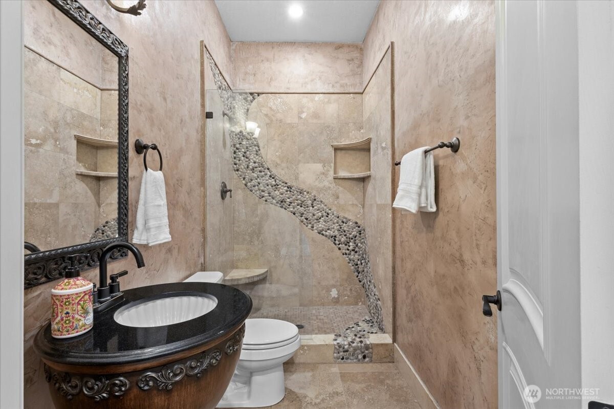 1931 Northwest 7th Avenue Camas, WA 98607 - Photo 15 of 40 a bathroom with a granite countertop sink toilet and shower