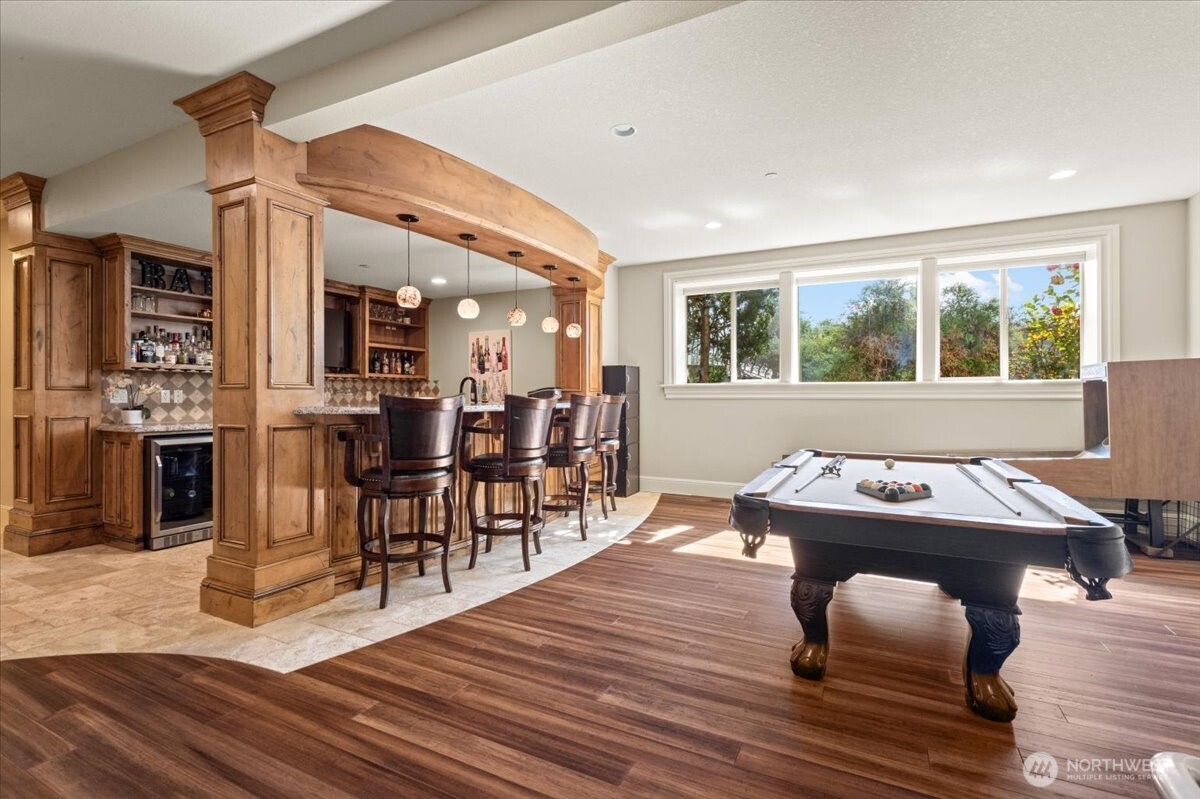 1931 Northwest 7th Avenue Camas, WA 98607 - Photo 22 of 40 a dining room with wooden floor and large windows