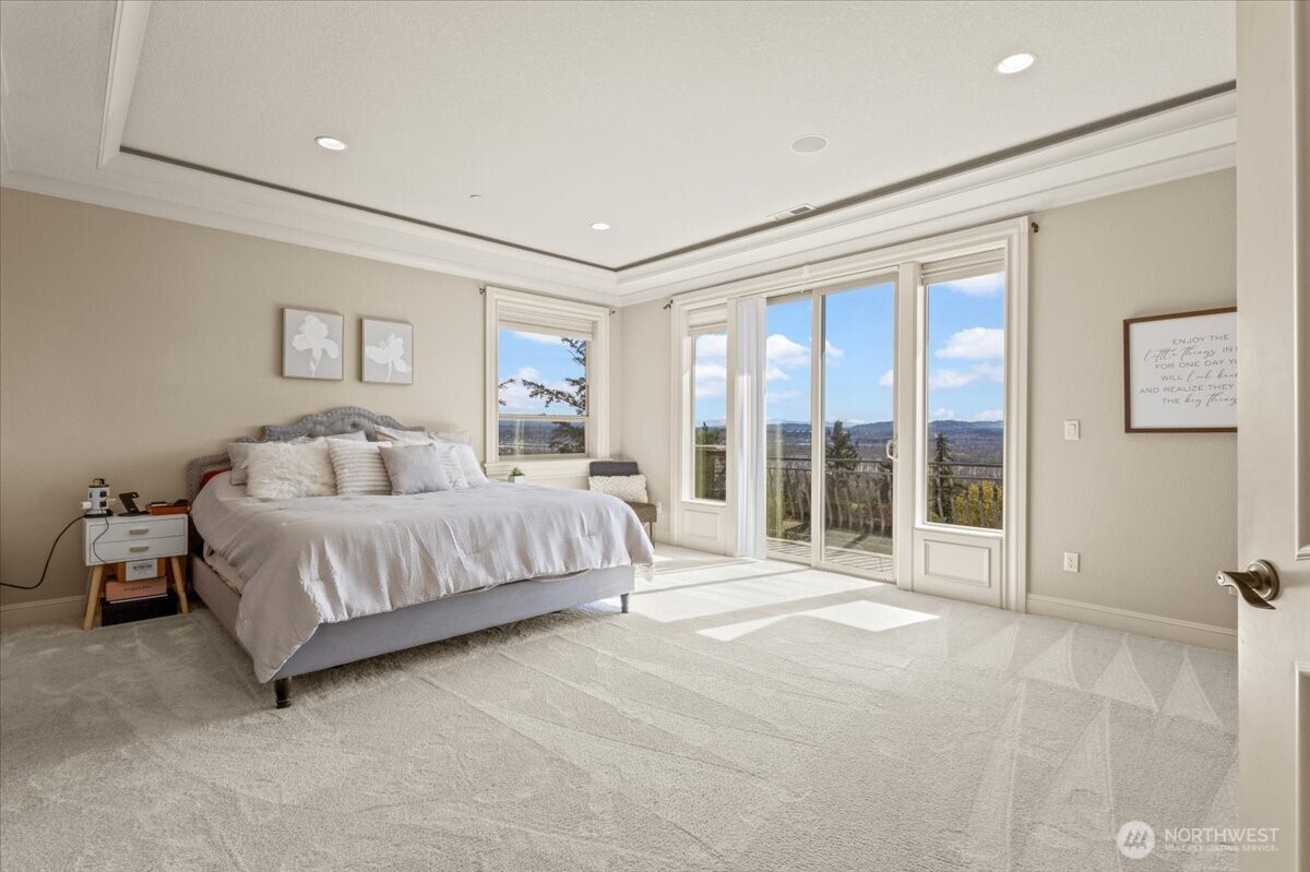 1931 Northwest 7th Avenue Camas, WA 98607 - Photo 26 of 40 a spacious bedroom with a large bed and a large window