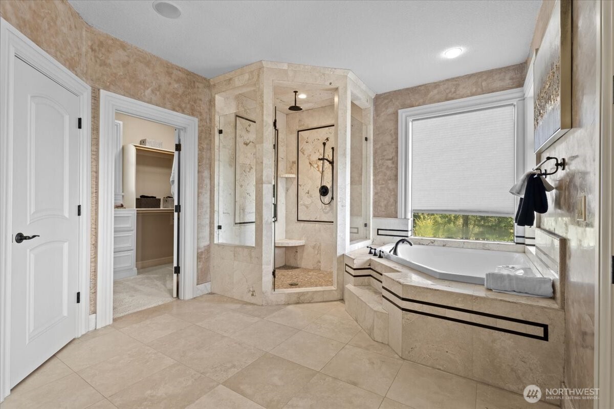 1931 Northwest 7th Avenue Camas, WA 98607 - Photo 30 of 40 a spacious bathroom with a tub shower and mirror