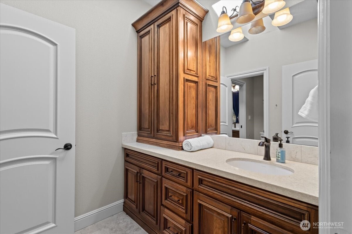 1931 Northwest 7th Avenue Camas, WA 98607 - Photo 33 of 40 a bathroom with a sink a vanity and a mirror