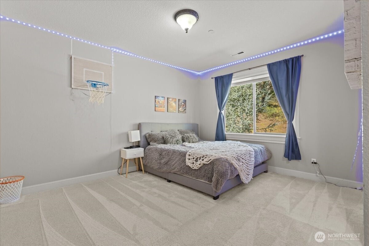 1931 Northwest 7th Avenue Camas, WA 98607 - Photo 34 of 40 a spacious bedroom with a bed and a window