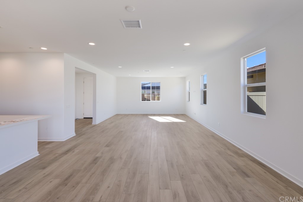 32324 Sonder Way Temecula, CA 92591 - Photo 4 of 17 a view of empty room with wooden floor and fan
