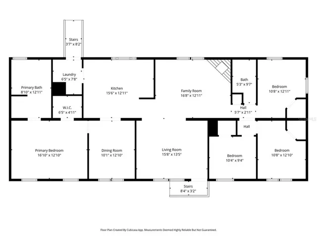 a view of an empty room with wooden floor and closet
