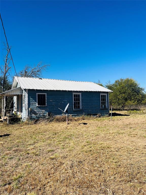 200 County Road 187 Comanche, TX 76442 - Photo 13 of 16 a backyard of a house with table and chairs