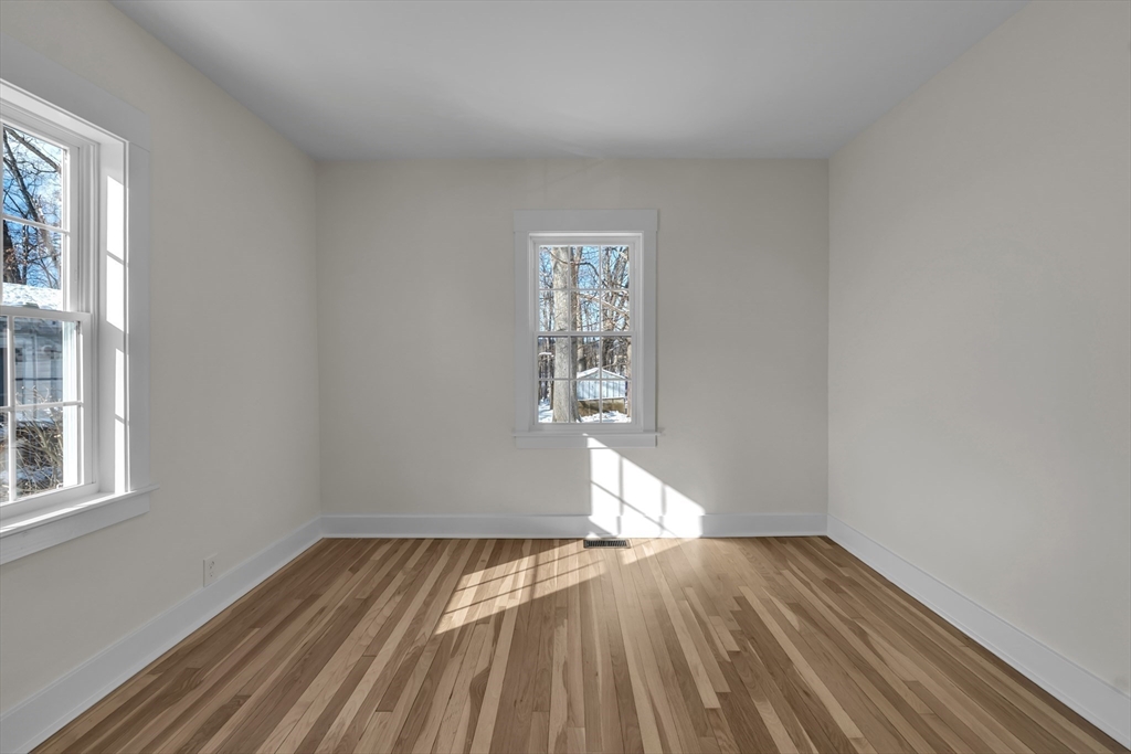 4 Hancock Street Shrewsbury, MA 01545 - Photo 17 of 33 a view of empty room with wooden floor and fan