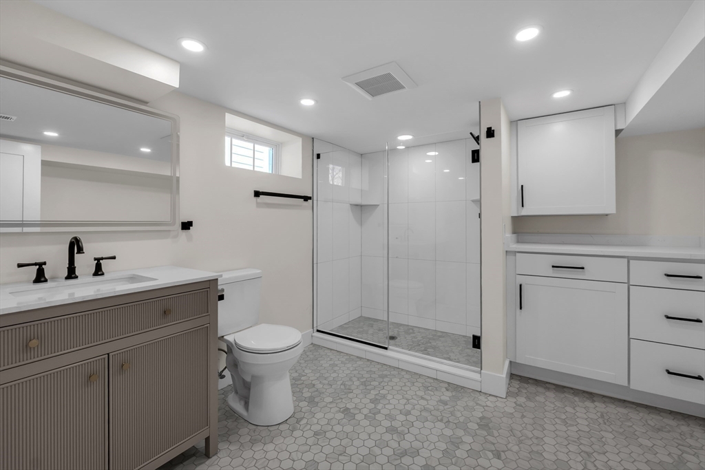 4 Hancock Street Shrewsbury, MA 01545 - Photo 27 of 33 a bathroom with a toilet sink and shower