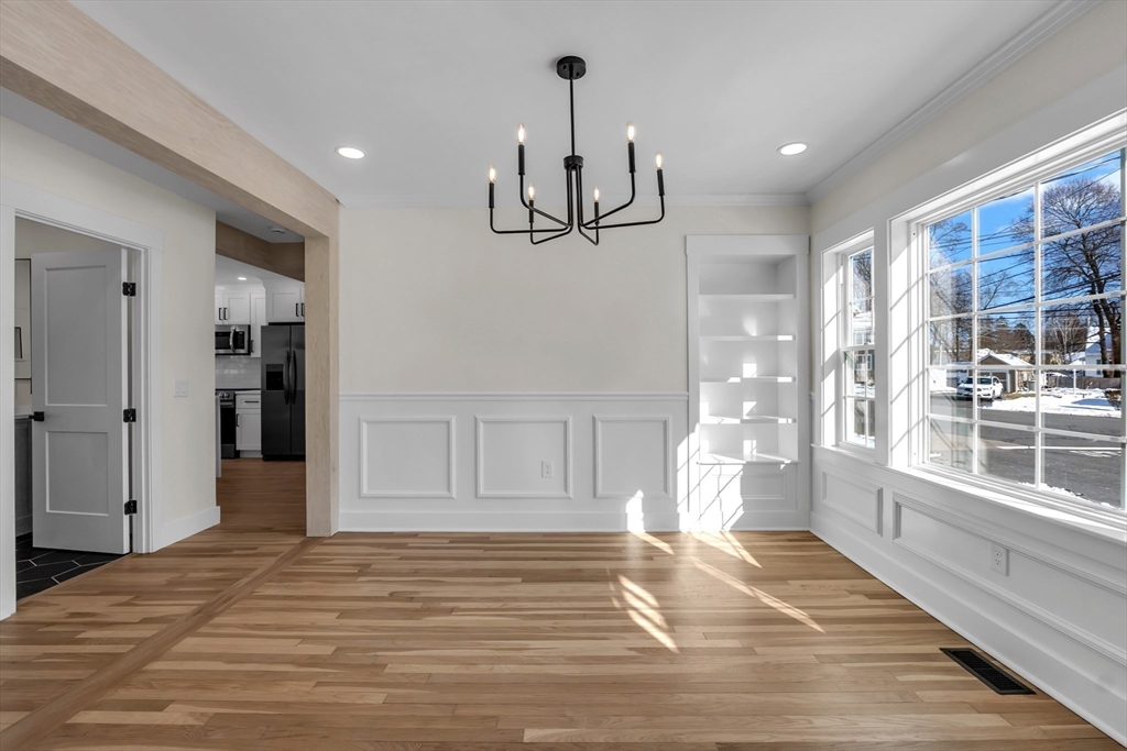 4 Hancock Street Shrewsbury, MA 01545 - Photo 6 of 33 a view of empty room with wooden floor and fan