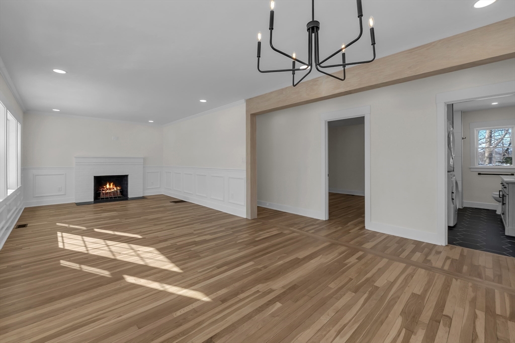 4 Hancock Street Shrewsbury, MA 01545 - Photo 7 of 33 a bedroom with a bed and a chandelier