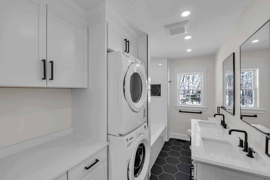 4 Hancock Street Shrewsbury, MA 01545 - Photo 10 of 33 a bathroom with a sink a washer and dryer