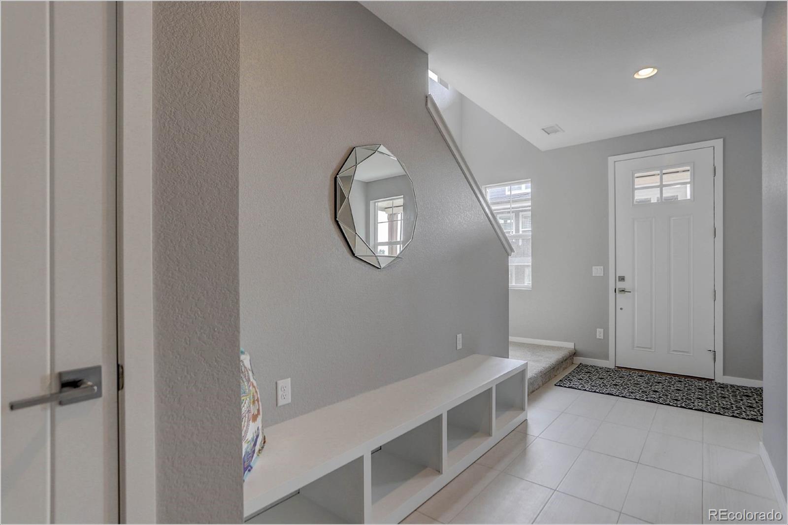 8928 Delacorte Street Highlands Ranch, CO 80129 - Photo 18 of 26 a spacious bathroom with a mirror and a sink