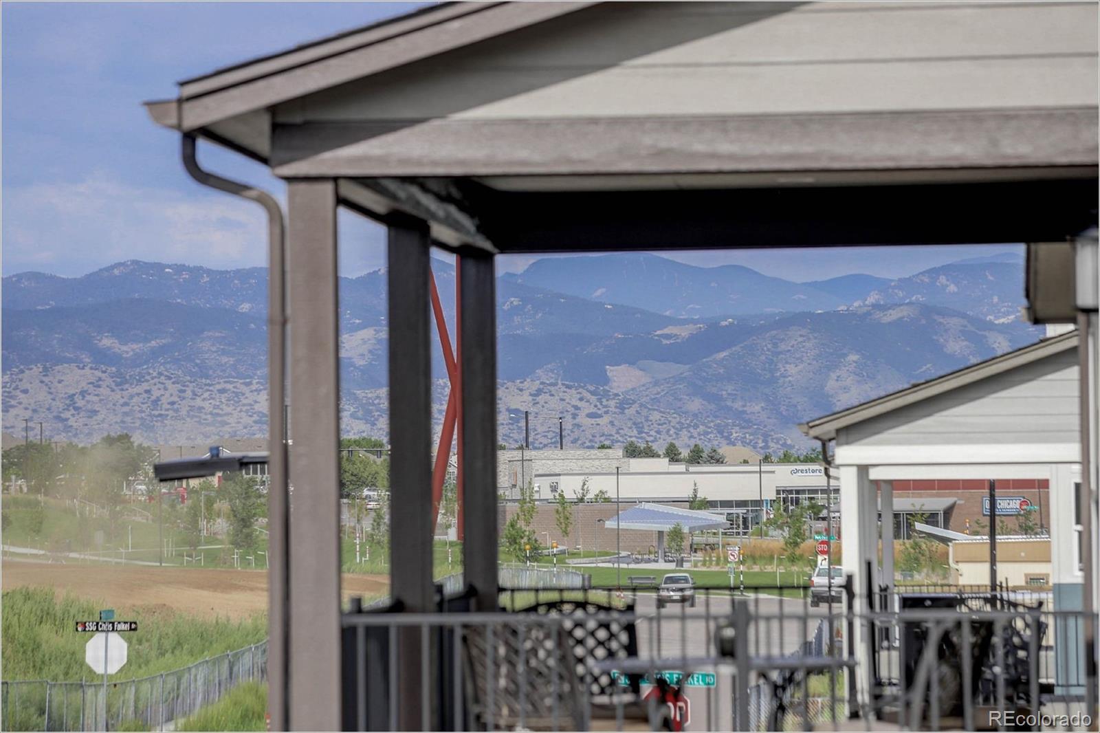 8928 Delacorte Street Highlands Ranch, CO 80129 - Photo 23 of 26 a black and white building with a outdoor view