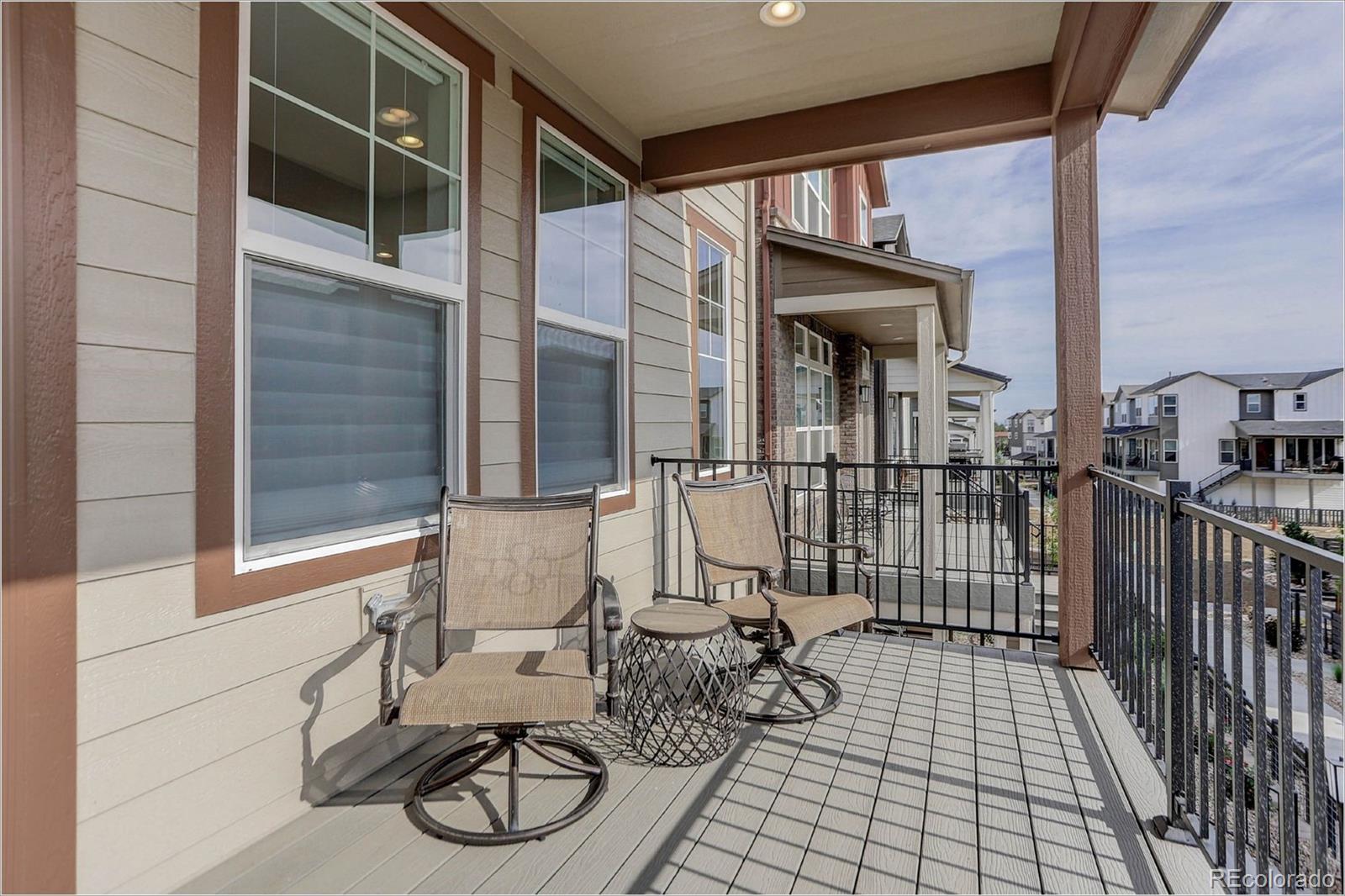 8928 Delacorte Street Highlands Ranch, CO 80129 - Photo 24 of 26 a view of balcony with two chairs and a window