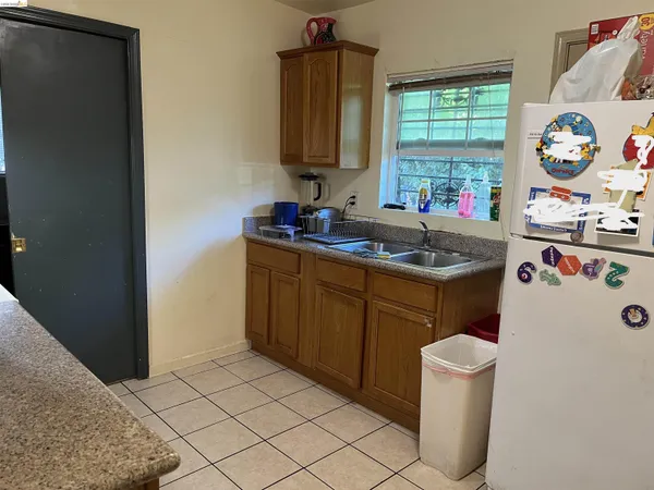 a kitchen with a sink stove and window