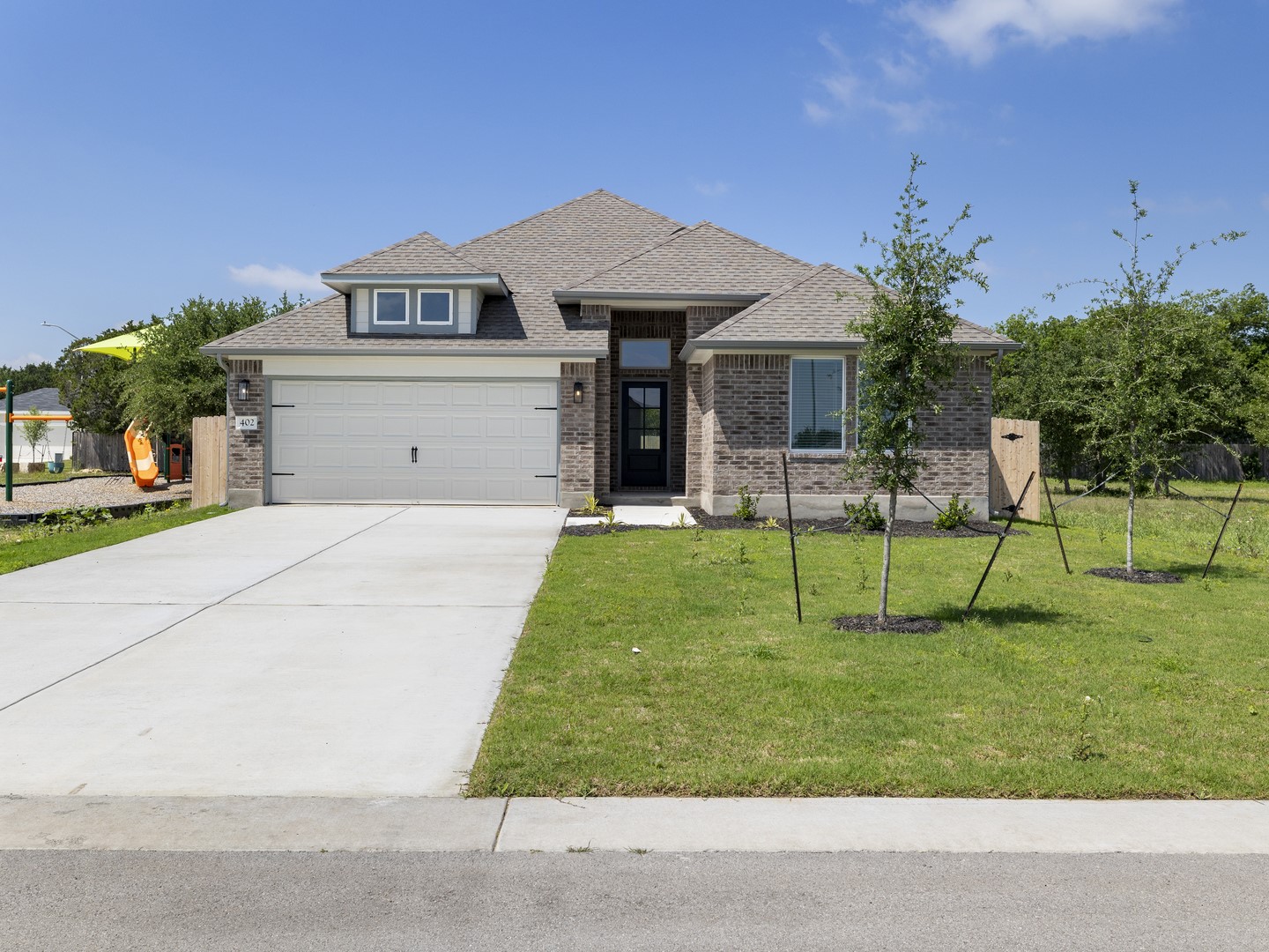 402 Judson Street Bertram, TX 78605 - Photo 1 of 27 a view of a house with a yard and sitting area