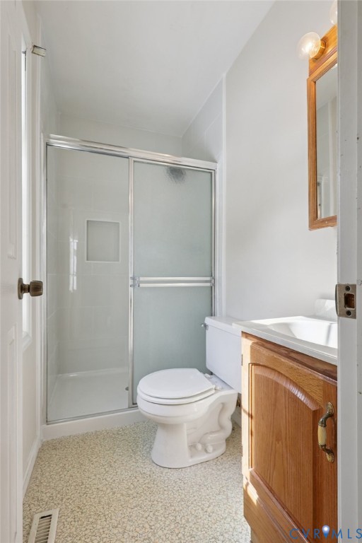 655 Holly Corner Road Fredericksburg, VA 22406 - Photo 17 of 35 a white toilet sitting next to a bathroom sink