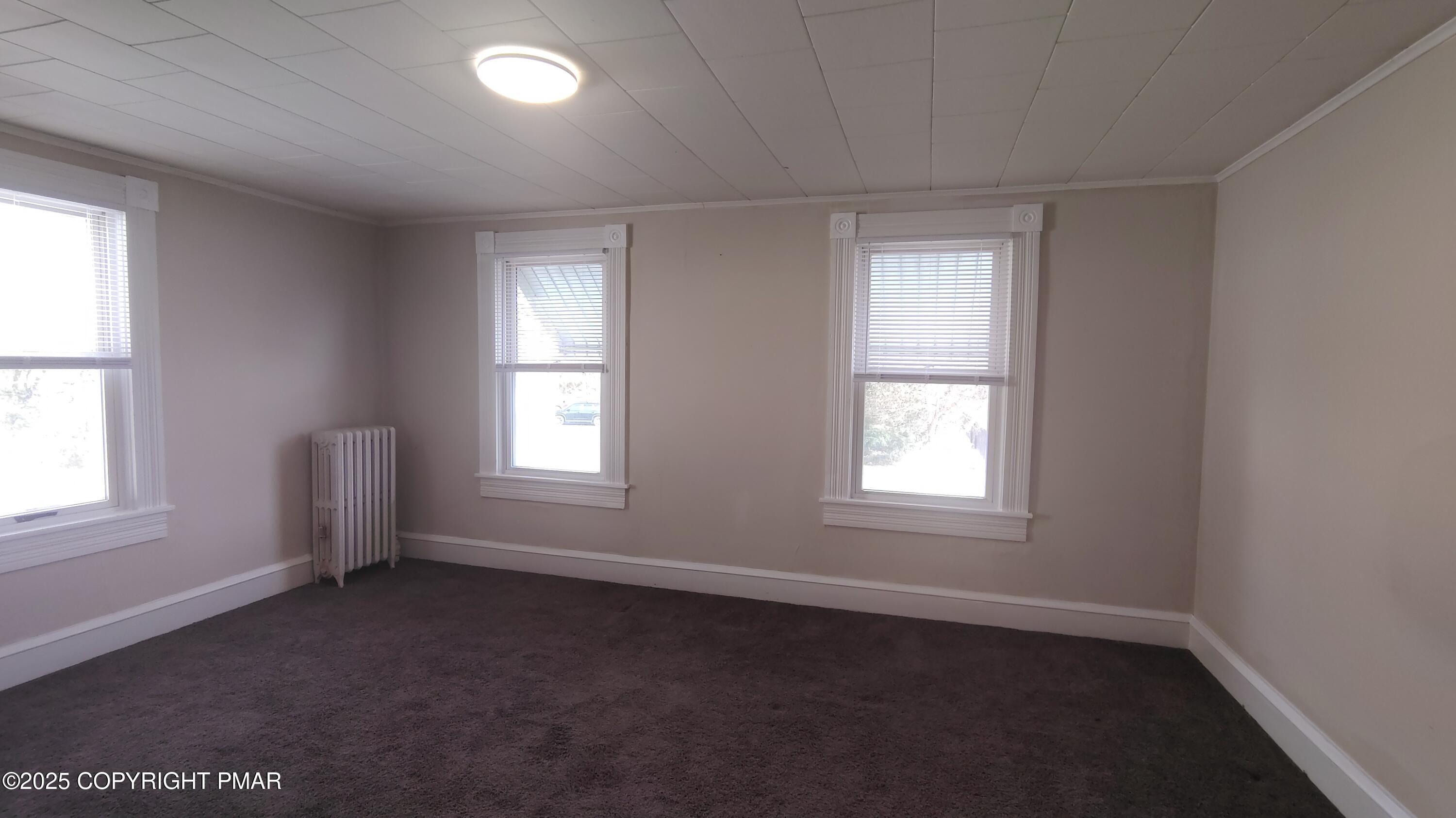 258 Factory Street Luzerne, PA 18709 - Photo 11 of 22 an empty room with a window