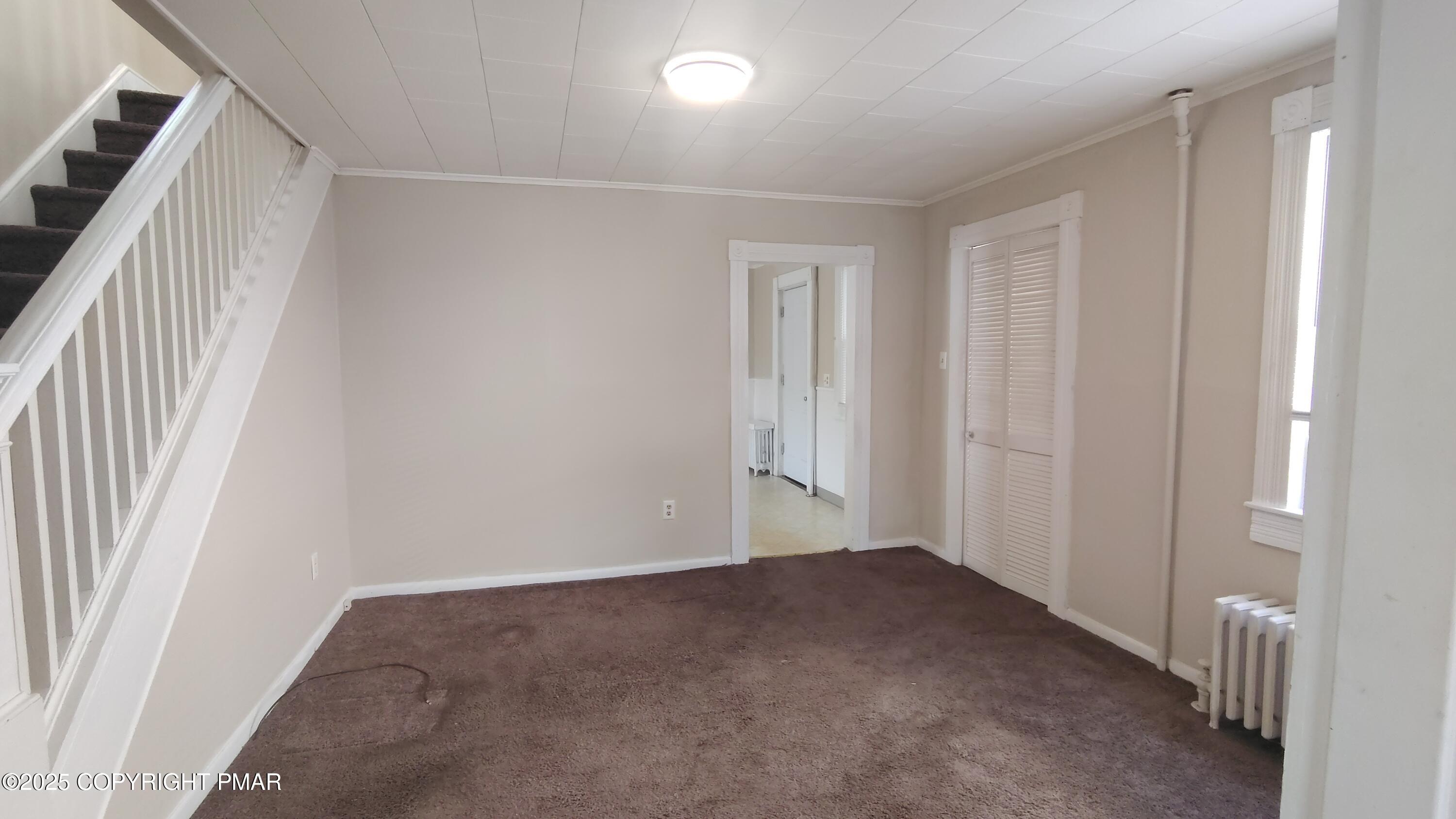 258 Factory Street Luzerne, PA 18709 - Photo 4 of 22 a view of an empty room with a window