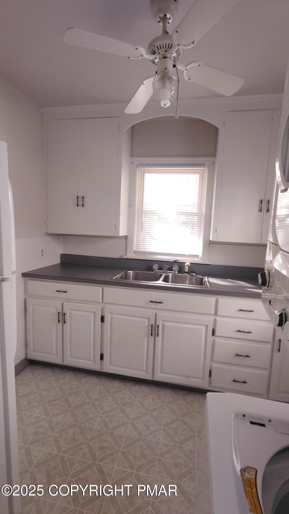 258 Factory Street Luzerne, PA 18709 - Photo 7 of 22 a kitchen with granite countertop white cabinets white stainless steel appliances with a sink and dishwasher