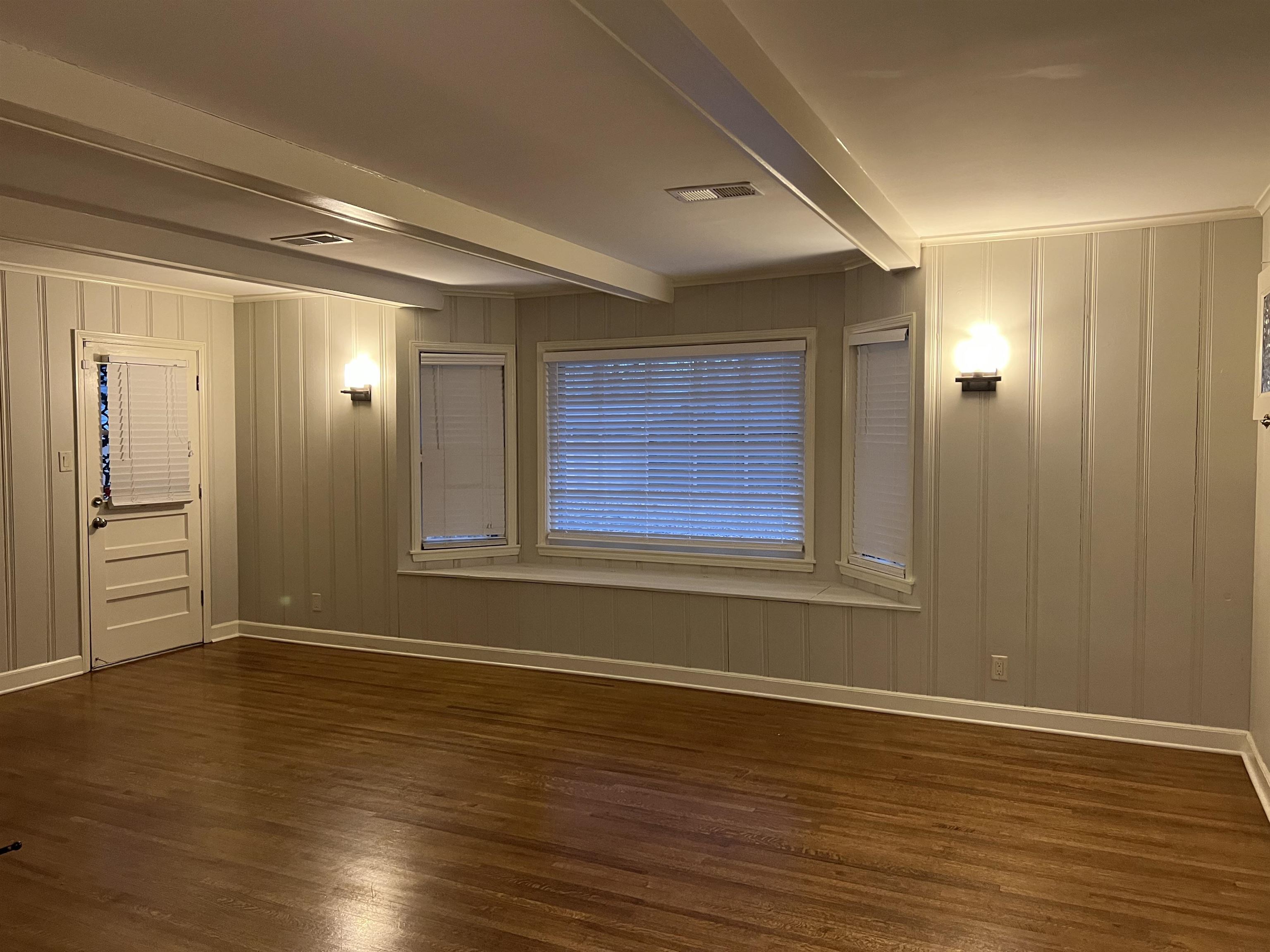 1653 Colonial Road Memphis, TN 38117 - Photo 6 of 15 a view of empty room with wooden floor and fan