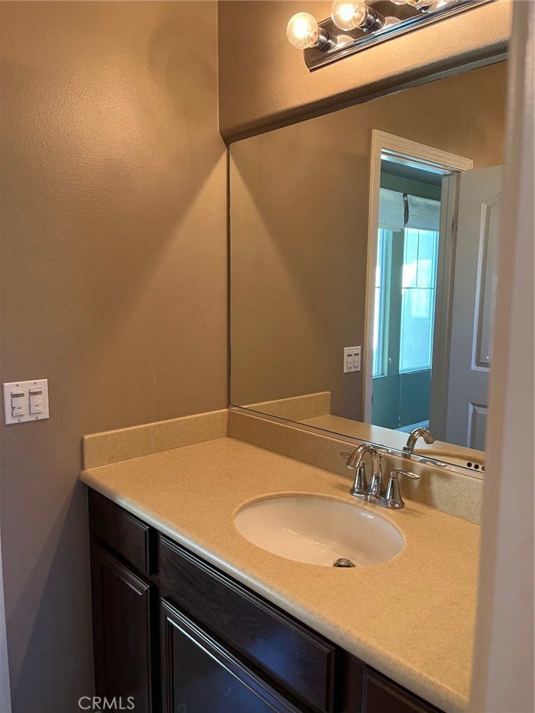 31885 Jaybee Lane Temecula, CA 92592 - Photo 17 of 35 a bathroom with a sink and a mirror