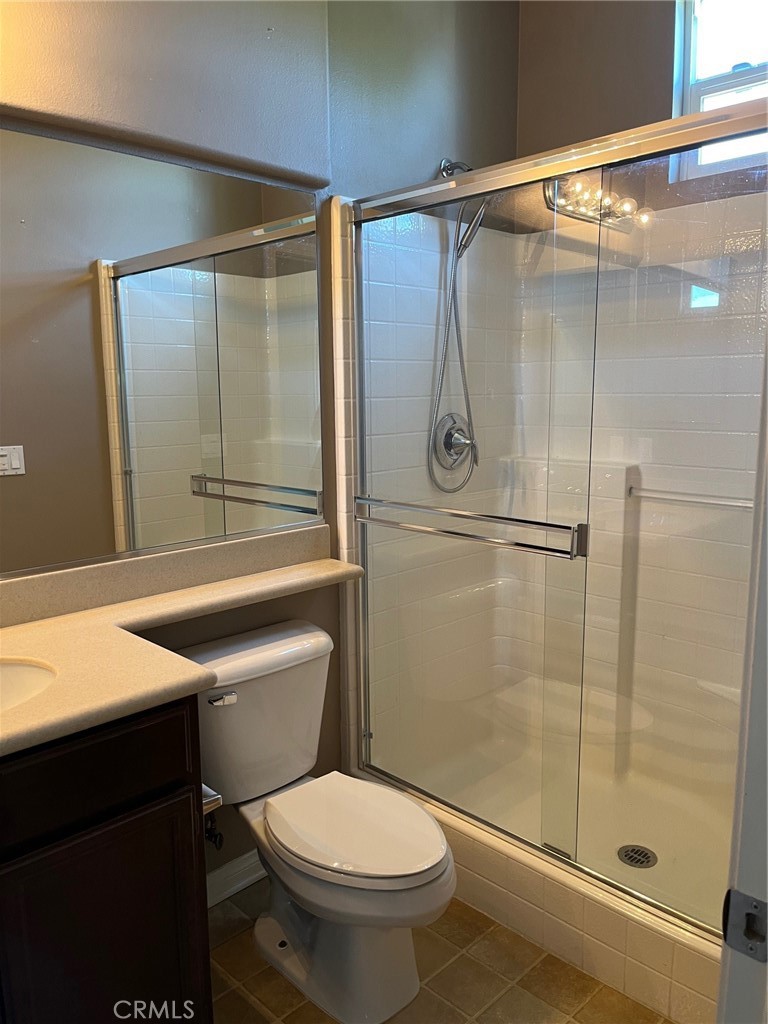 31885 Jaybee Lane Temecula, CA 92592 - Photo 21 of 35 a bathroom with a shower and a toilet