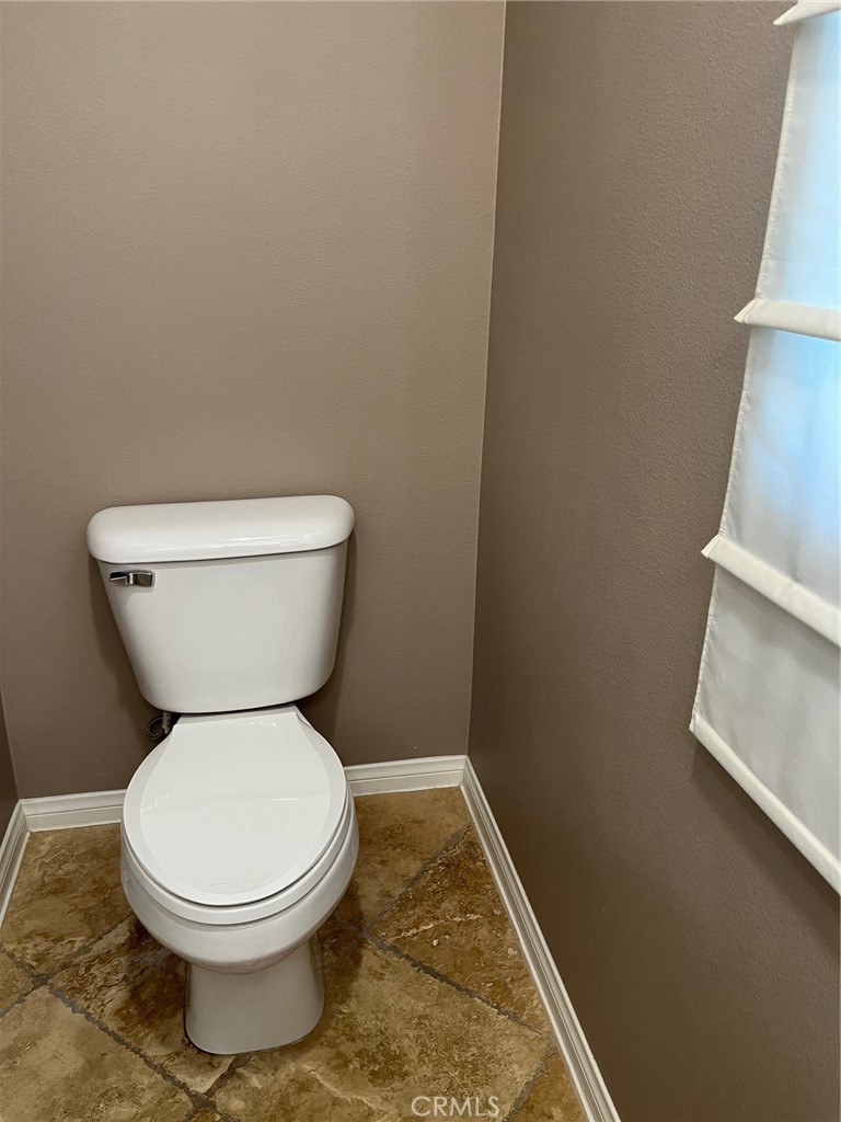 31885 Jaybee Lane Temecula, CA 92592 - Photo 7 of 35 a white toilet sitting next to a white sink