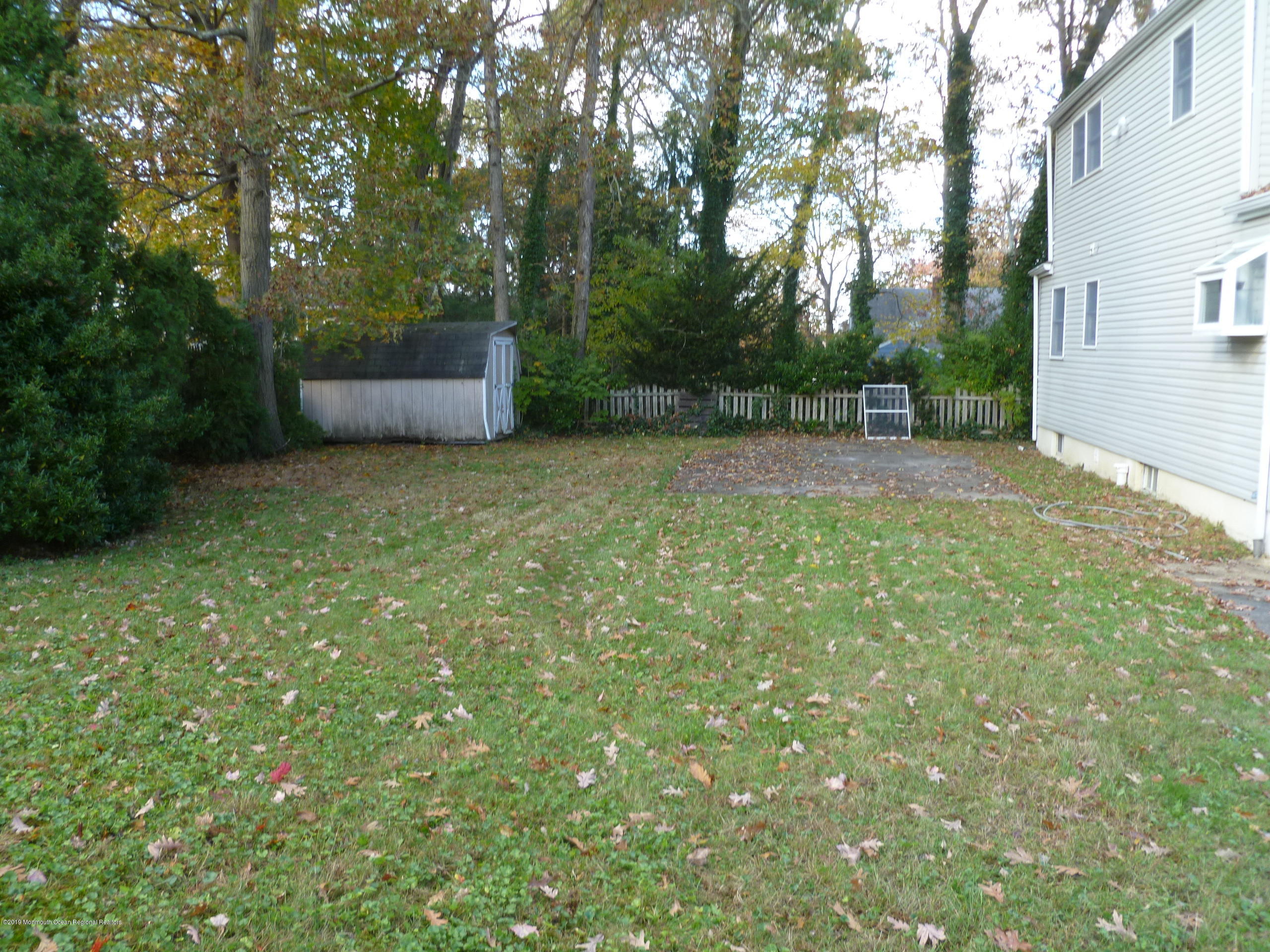 416 Ely Road Neptune Township, NJ 07753 - Photo 13 of 13 a backyard of a house with lots of green space