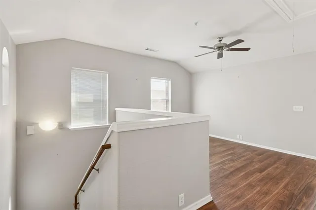 a view of a hallway with a white walls