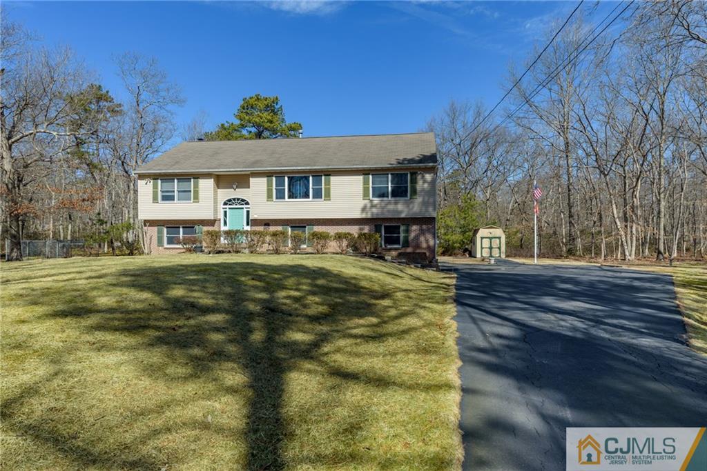 12 Thompson Bridge Road Jackson, NJ 08527 - Photo 1 of 25 a front view of a house with a yard
